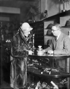 Salesman shows a Hankscraft egg cooker to a customer at Harloff-Loprich Electric Company, 506 State Street. December 1928. Angus McVicar photo Whi-21460  courtesy of Wisconsin Historical Society.